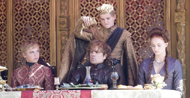 King Joffrey ridicules his uncle Tyrion by pouring wine on his head during his wedding feast